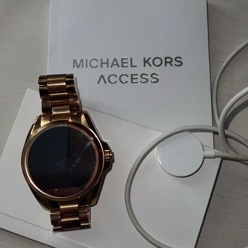 Michael kors smart watch with charger and paperwork